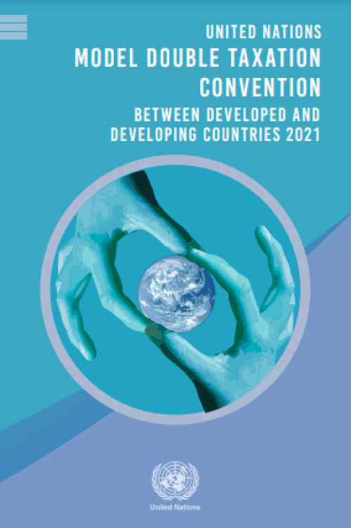 Two hands hold the Earth on the cover of the UN Model Convention